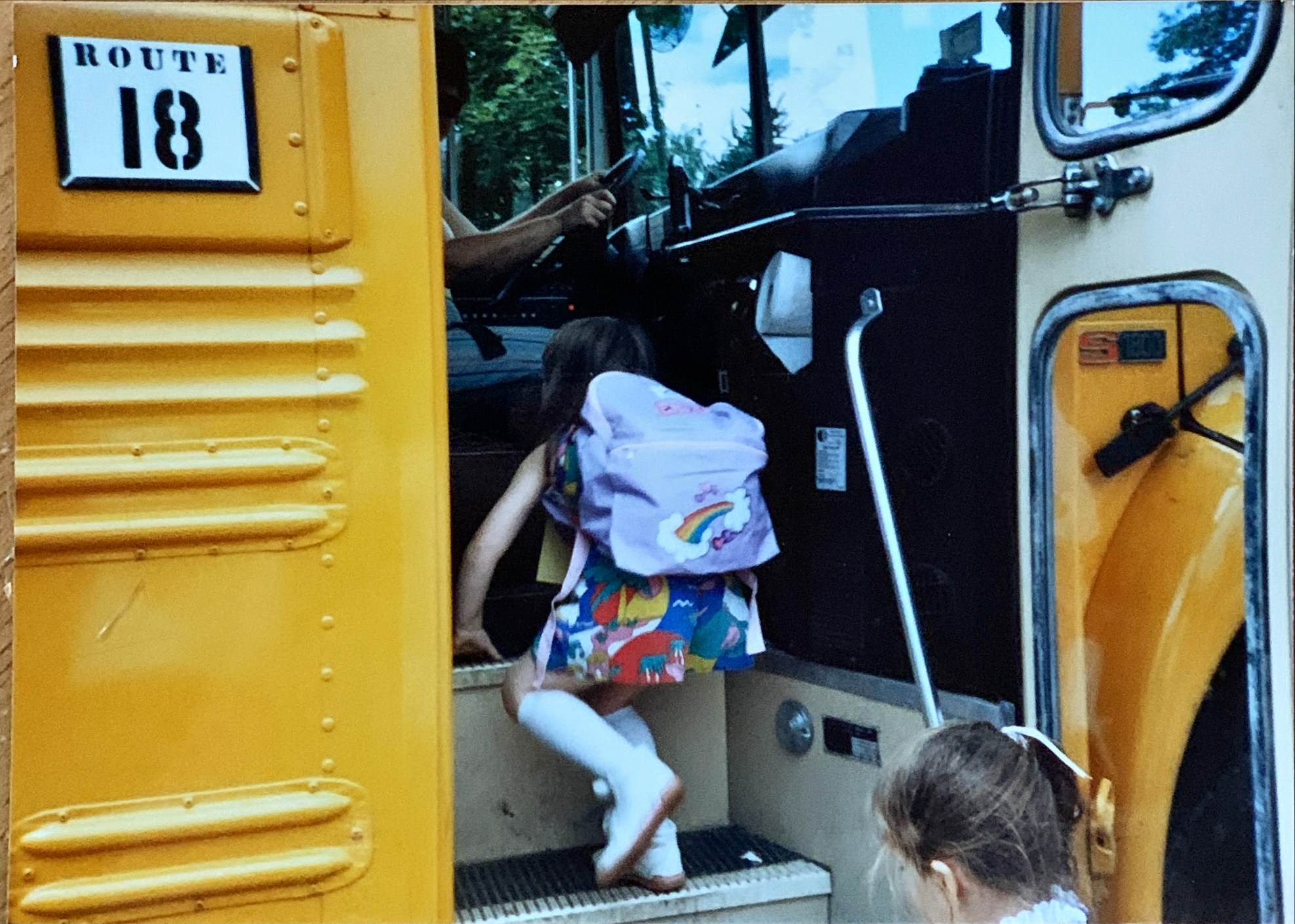 Emma getting on school bus